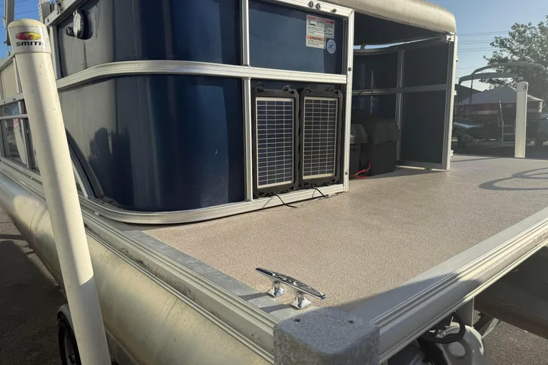 Slide: The Image of 2015 SunChaser 22 vs pontoon boat with blue exterior and spacious deck. - 4