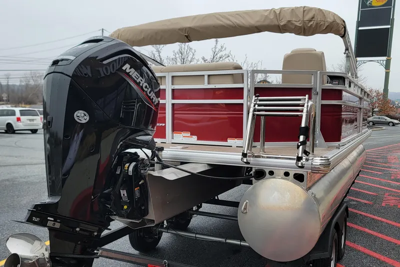 Slide: The Image of 2024 Sun Tracker Party Barge 20 DLX pontoon boat with Mercury outboard motor. - 6