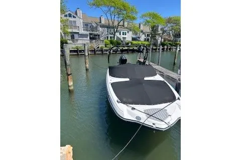 Slide: The Image of 2022 Monterey boat docked in a scenic waterfront residential area. - 4