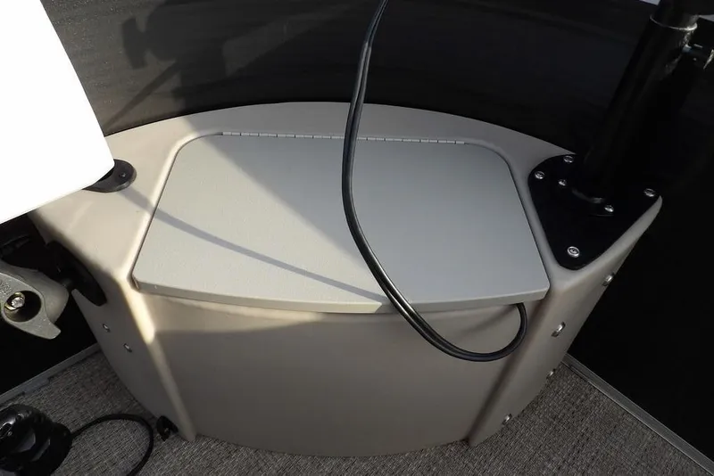 Slide: The Image of 2018 Bennington 23SF boat interior detail with storage compartment and wiring. - 17
