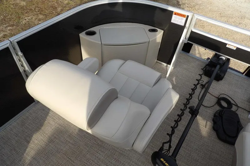 Slide: The Image of 2018 Bennington 23SF boat interior with beige seating and fishing equipment. - 21