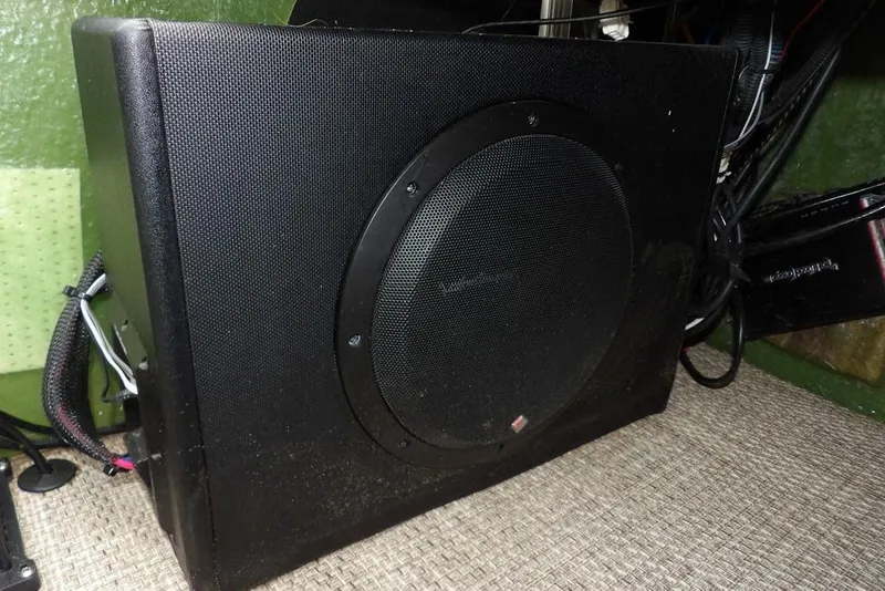 Slide: The Image of Black subwoofer installed in a 2018 Bennington 23SF boat interior. - 27
