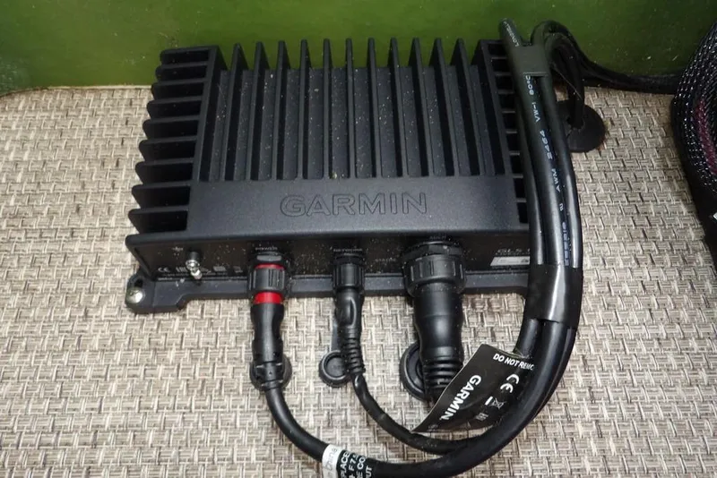 Slide: The Image of Garmin device installed on 2018 Bennington 23SF boat, featuring multiple cables and connectors. - 29