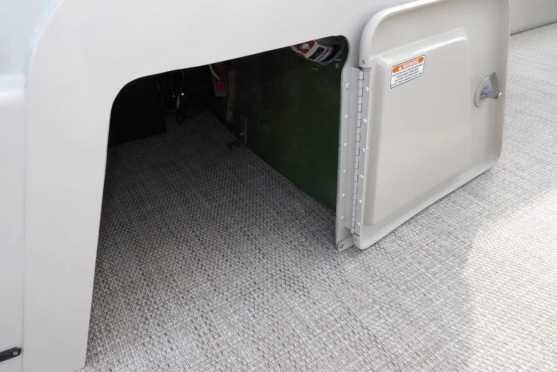 Slide: The Image of Open storage compartment on 2018 Bennington 23SF boat with textured flooring. - 32