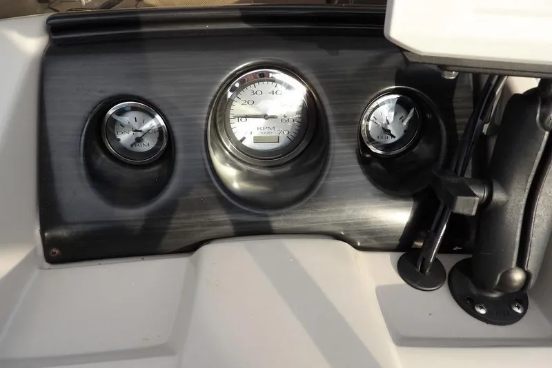 Slide: The Image of Dashboard of 2018 Bennington 23SF boat with RPM and trim gauges. - 34