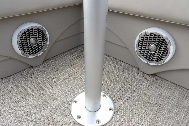 Slide: The Image of 2018 Bennington 23SF boat interior with dual speakers and carpeted flooring. - 49