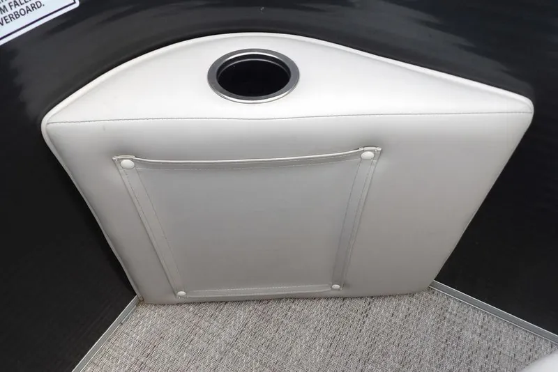 Slide: The Image of 2018 Bennington 23SF boat interior with cup holder and storage pocket. - 52