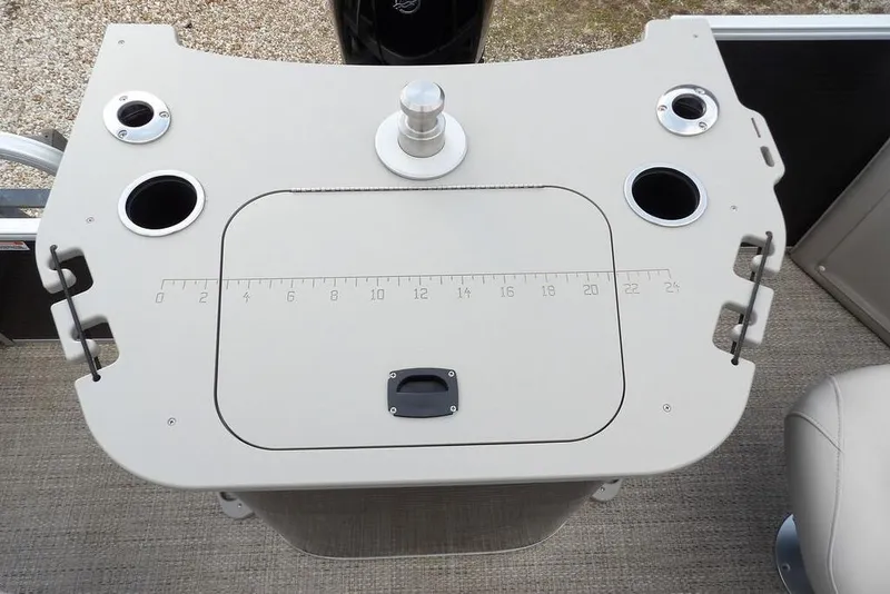 Slide: The Image of 2018 Bennington 23SF boat console with cup holders and measuring scale. - 54