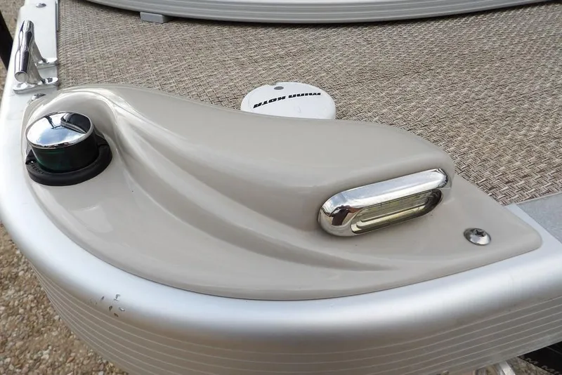 Slide: The Image of 2018 Bennington 23SF boat detail with navigation light and textured deck surface. - 59