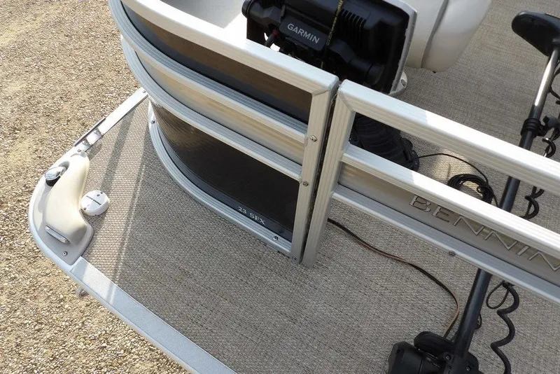 Slide: The Image of 2018 Bennington 23SF pontoon boat deck with Garmin equipment and railing details. - 71
