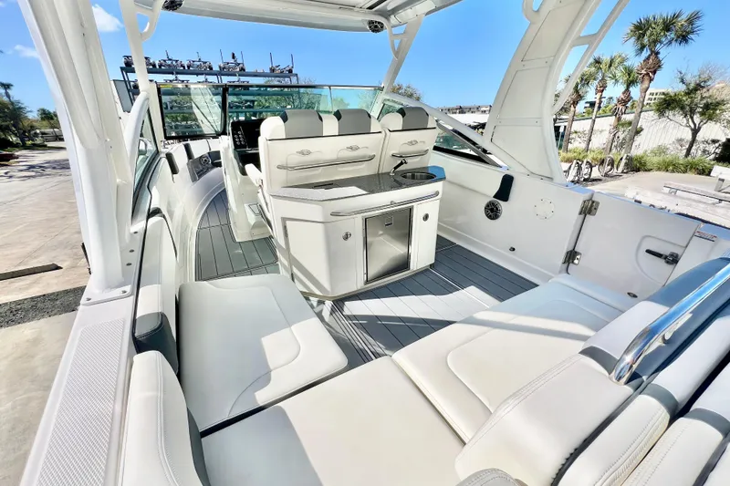 Slide: The Image of 2023 Chaparral 300 OSX boat interior with sleek seating and modern amenities. - 12