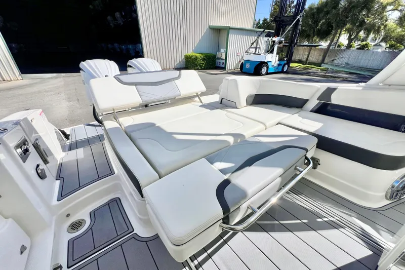 Slide: The Image of 2023 Chaparral 300 OSX boat interior with luxurious seating and modern design. - 15