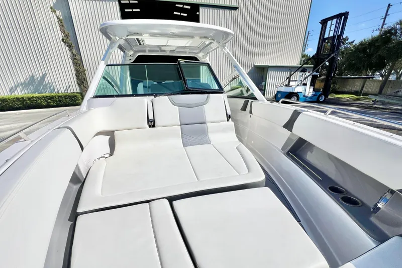 Slide: The Image of 2023 Chaparral 300 OSX boat interior with spacious seating and modern design. - 26