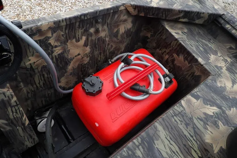 Slide: The Image of 2018 Crestliner 1660 Retriever with red fuel tank and camouflage interior design. - 14