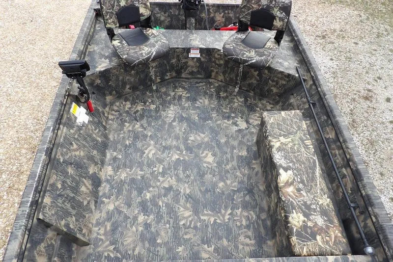 Slide: The Image of 2018 Crestliner 1660 Retriever boat interior with camouflage seating and flooring. - 16