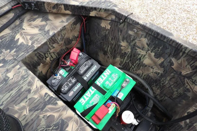 Slide: The Image of 2018 Crestliner 1660 Retriever boat with camo interior and dual batteries. - 17