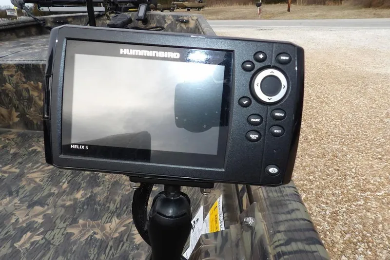Slide: The Image of Fishfinder on 2018 Crestliner 1660 Retriever boat, featuring Humminbird Helix 5 display. - 26