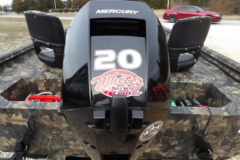 Slide: The Image of 2018 Crestliner 1660 Retriever with Mercury engine, camo design, and dual seats. - 29