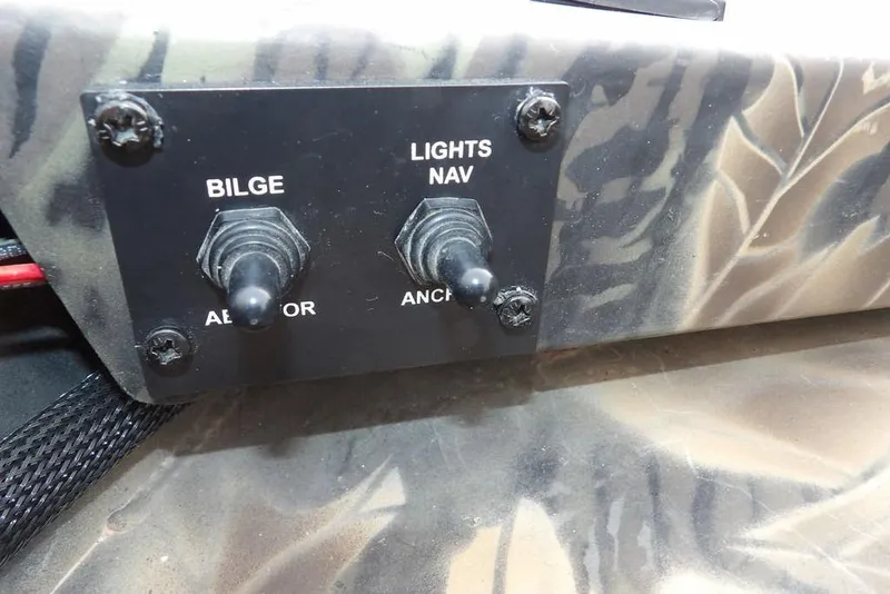 Slide: The Image of Control panel of 2018 Crestliner 1660 Retriever with bilge and navigation light switches. - 30