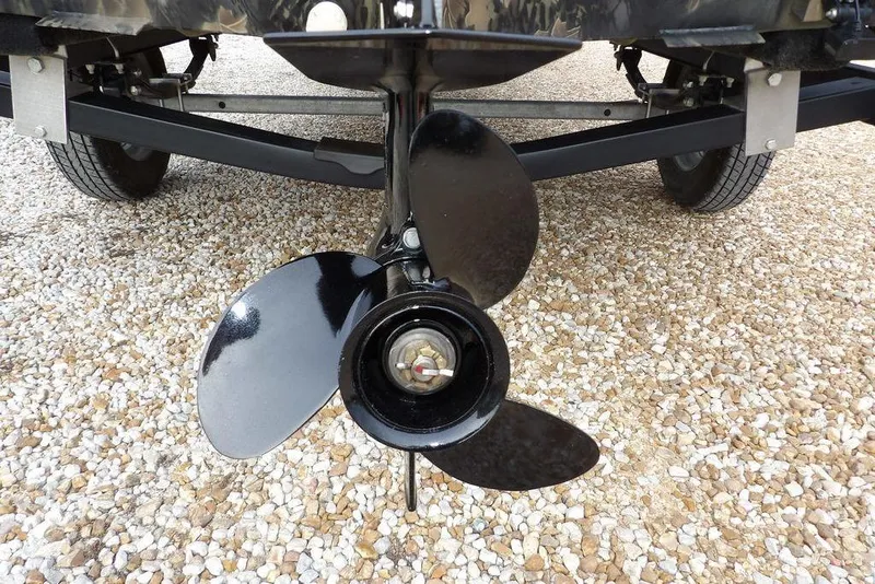 Slide: The Image of 2018 Crestliner 1660 Retriever boat propeller on gravel surface. - 32