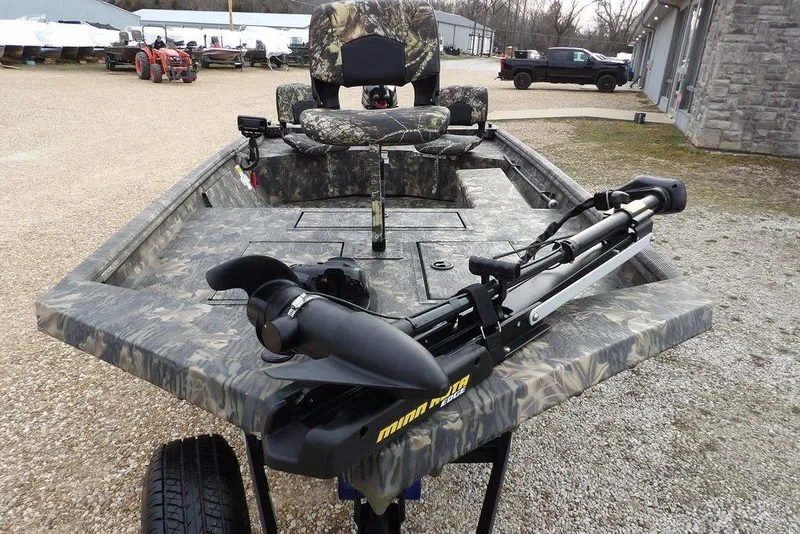 Slide: The Image of 2018 Crestliner 1660 Retriever boat with camouflage design and trolling motor. - 4