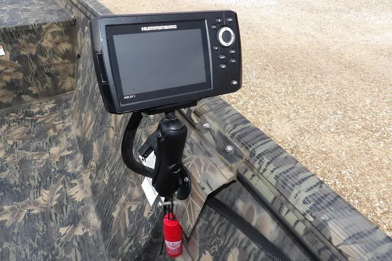 Slide: The Image of 2018 Crestliner 1660 Retriever with Humminbird Helix 5 fish finder, camo interior. - 9