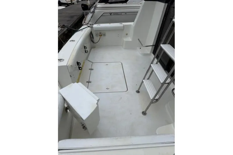 Slide: The Image of 1993 Silverton 34 Convertible boat deck with ladder and storage compartments. - 19