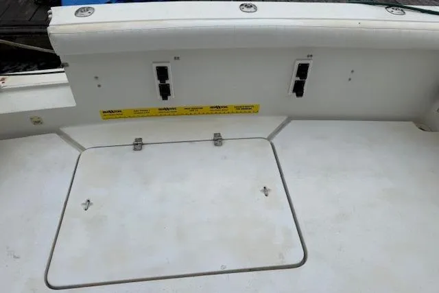 Slide: The Image of 1993 Silverton 34 Convertible boat deck with storage hatch and control panel. - 20
