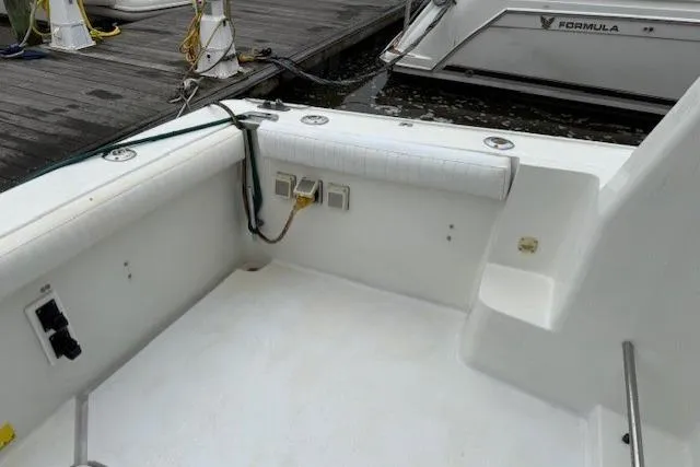 Slide: The Image of 1993 Silverton 34 Convertible boat deck with docked view. - 22