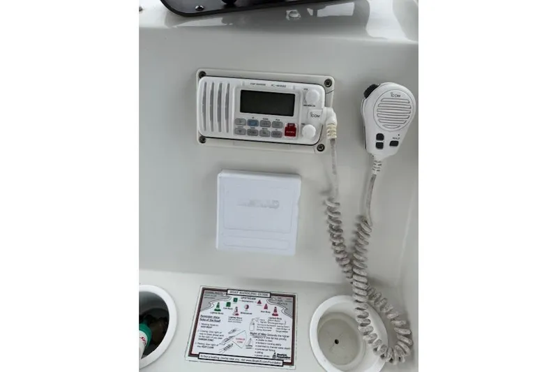 Slide: The Image of 1993 Silverton 34 Convertible boat radio and microphone setup. - 28