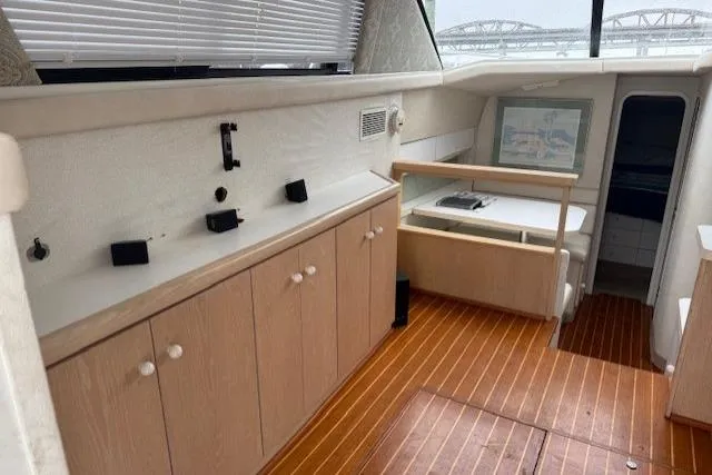 Slide: The Image of Interior of 1993 Silverton 34 Convertible yacht with wood flooring and cabinetry. - 31