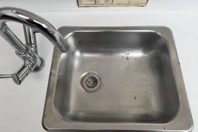 Slide: The Image of Stainless steel sink in 1993 Silverton 34 Convertible boat kitchen. - 40