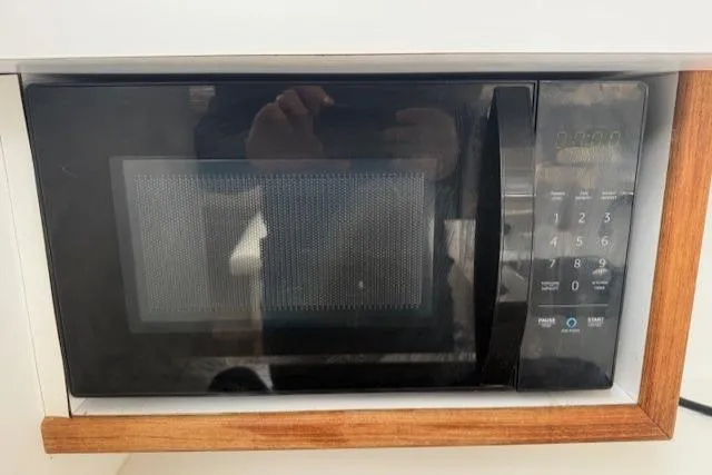 Slide: The Image of Built-in microwave with digital keypad on a 1993 Silverton 34 Convertible boat. - 43
