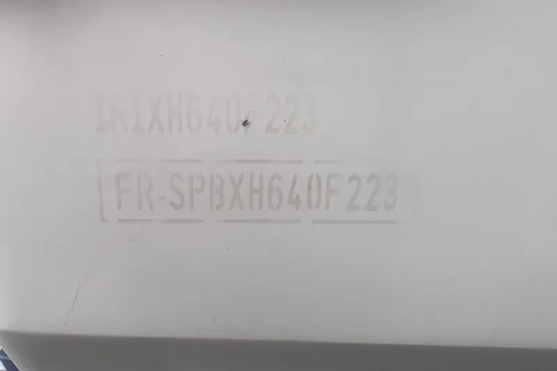 Slide: The Image of 2023 Jeanneau NC Weekender 795 Series 2 hull identification number on white surface. - 15