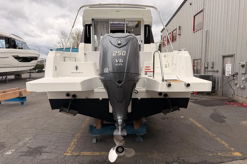 Slide: The Image of 2026 Jeanneau NC Weekender 795 Series 2 with Yamaha 250 V6 engine, docked outdoors. - 5