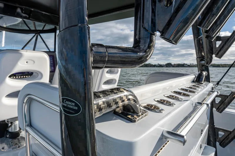 Slide: The Image of 2024 Contender 44 ST boat with carbon fiber details and rod holders on deck. - 11