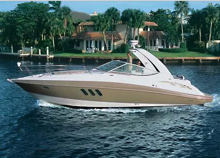 The Image of 2008 Cruisers Yachts 330 Express docked, featuring sleek design and covered cockpit. - 0