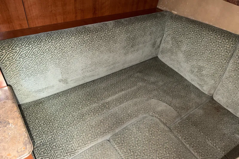 Slide: The Image of 2008 Cruisers Yachts 330 Express interior seating with patterned upholstery. - 23