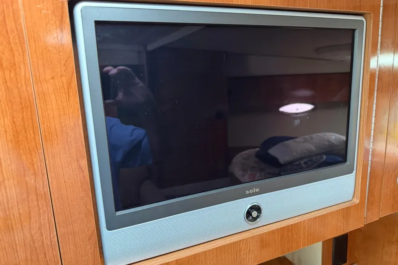 Slide: The Image of Flat-screen TV in 2008 Cruisers Yachts 330 Express cabin interior. - 32