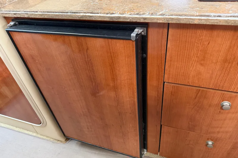 Slide: The Image of 2008 Cruisers Yachts 330 Express interior with wood cabinetry and countertop. - 41