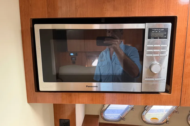 Slide: The Image of Panasonic microwave in 2008 Cruisers Yachts 330 Express kitchen area. - 43