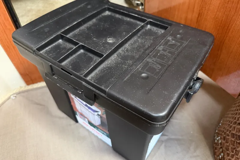 Slide: The Image of Black storage box on a 2008 Cruisers Yachts 330 Express boat interior. - 44