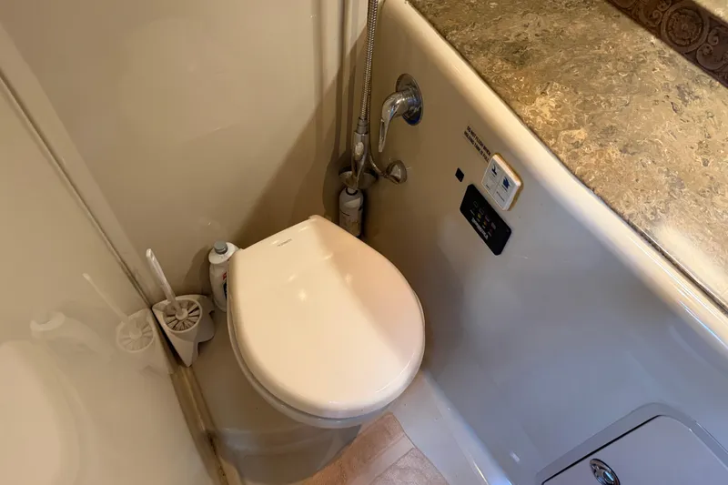 Slide: The Image of 2008 Cruisers Yachts 330 Express bathroom with toilet and countertop. - 47