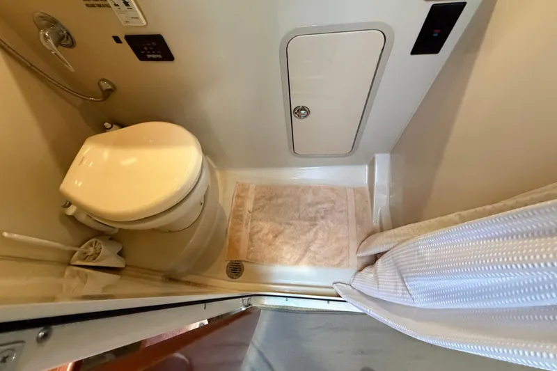 Slide: The Image of Bathroom interior of 2008 Cruisers Yachts 330 Express with shower and toilet. - 49