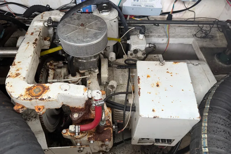 Slide: The Image of Engine compartment of a 2008 Cruisers Yachts 330 Express, showing mechanical components and wiring. - 58