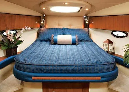 Slide: The Image of 2008 Cruisers Yachts 330 Express interior with wood cabinetry and countertop. - 6