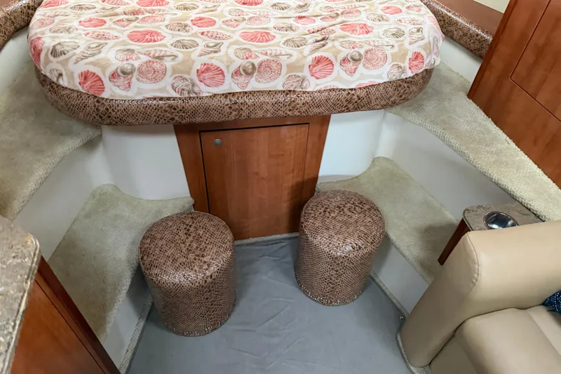 Slide: The Image of 2008 Cruisers Yachts 330 Express cabin interior with patterned bedding and seating. - 60