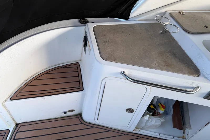 Slide: The Image of 2008 Cruisers Yachts 330 Express interior with storage and countertop details. - 65