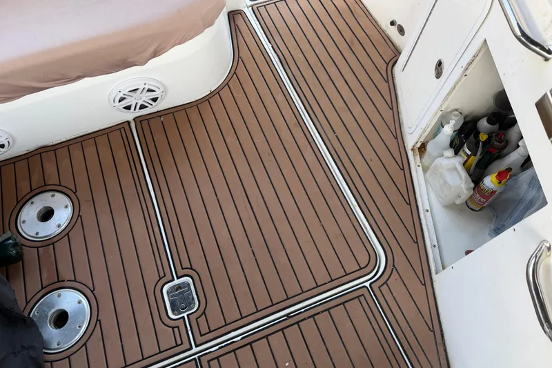Slide: The Image of 2008 Cruisers Yachts 330 Express deck with storage compartment and marine accessories. - 70
