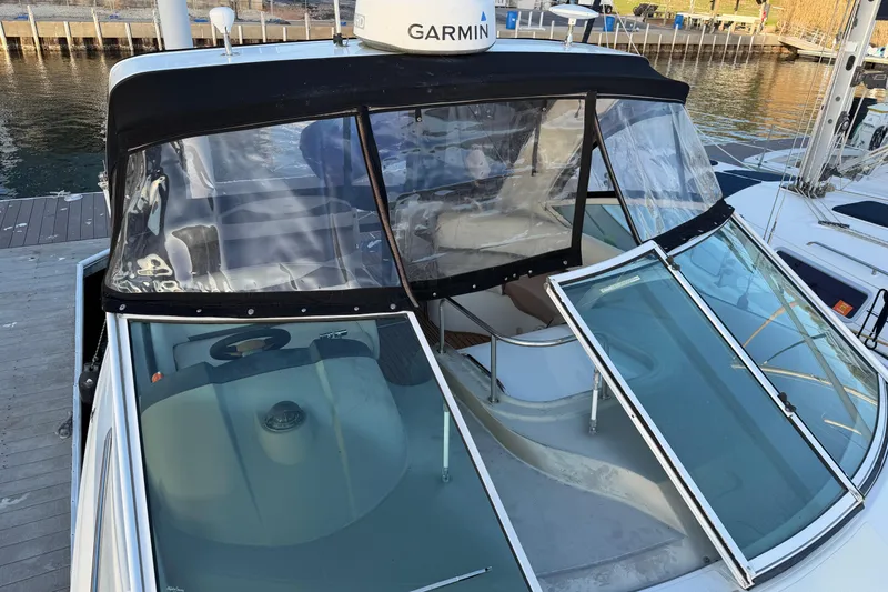 Slide: The Image of 2008 Cruisers Yachts 330 Express docked, featuring Garmin equipment and spacious cockpit. - 75